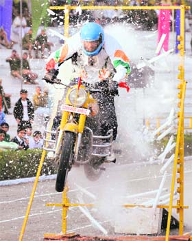 A Haryana police commando performs a daring act on the concluding day of the 42nd Haryana Police Games at Madhuban in Karnal