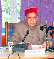 Chief Minister PK Dhumal addresses a conference in Shimla on Thursday. 