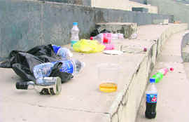 Liquor and soft drink bottles inside Guru Nanak Stadium after the PPL tournament in Ludhiana on Thursday. Photos: Inderjeet Verma 