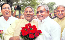 pocketful of roses: Bihar Assembly Speaker Uday Narayan Chaudhary greets Chief Minister Nitish Kumar in Patna