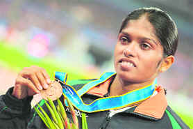 Tintu Luka poses with her bronze medal for the women's 800m. 