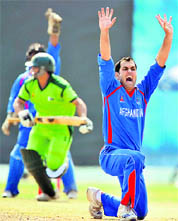 Afghanistans Mohammad Eisakhil (R) makes a successful leg before wicket appeal against Pakistans Khalid Latif on Thursday. 