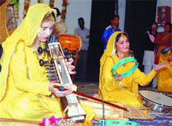 Students of Sarup Rani Government College play traditional instruments during the Punjabi Week-2010 in Amritsar on Friday.