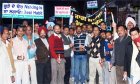 Members of the Environment Society along with other organisations taking out a candle march against lack of basic facilities in Mansa on Friday. 