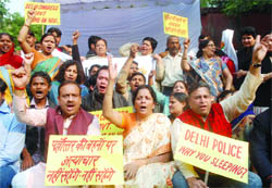BJP activists protest against the Delhi police and the state government during a demonstration held against the gangrape of a north-east girl, at Jantar Mantar 