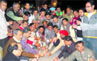 BJP workers hold a candle march in memory of 26/11 victims at the Clock Tower, Dehradun, on Friday.