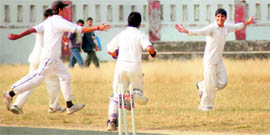 Players celebrate after taking a wicket in a match in the Inter-College Cricket Tournament in Dehradun on Friday.