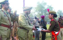 Punjab DGP P.S. Gill presents an award to a woman constable at the passing-out parade at the Punjab Police Academy in Phillaur on Friday