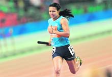 Mandeep Kaur finishes the Indian teams final leg to win gold in the women's 4x400 relay final in the athletics competition in Guangzhou on Friday.