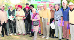 Senior citizens are all smiles after their win in the Happy Heart Golf Tournament at the Chandigarh Golf Club 