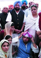 PPCC President Capt Amarinder Singh offers condolences to the family of late Parliamentary Secretary Parkash Singh at the bhog ceremony at Sloh village in Nawanshahr on Saturday.