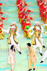 Indian singers Tanya Gupta (left) from Jammu and Rave Tripathi dance during the closing ceremony of the 16th Asian Games in Guangzhou in China 