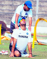 Yuvraj Singh stretches during a practice session before the first ODI against New Zealand in Guwahati on Saturday.