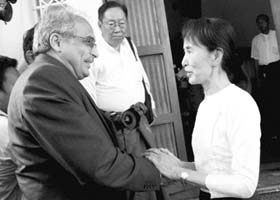 Suu Kyi welcomes Vijay Nambiar, chief of staff for UN Secretary-General Ban Ki-moon, at her home in Yangon