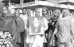 Family members of Payal along with her photograph come out of the Mini Secretariat in Panchkula on Sunday.