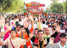 Devotees partcipate in the Lord Jagannath Rath Yatra in Panchkula on Sunday. 