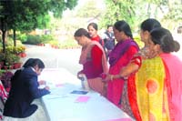 Women get themselves registered at a free health camp at Balawala near 