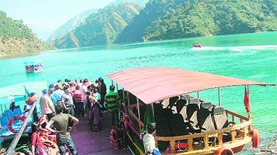 Tourists board a boat at Chamera lake. 