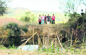 A photograph of a pond in ward number 8 of Mawa village in Patrara panchayat.