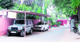 A car shed outside the house of Addl DCP Sandeep Goel.