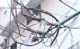 A maze of power cables poses a grave threat to the lives of traders and visitors.