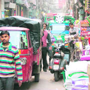 Shopkeepers have encroached upon a road, leaving little space for vehicles to manoeuvre, in Meena Bazaar, Ludhiana.