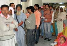 Patients await their turn in a corridor of the Civil Hospital, Bathinda, on Monday.