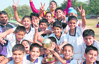 Members of St Stephens School, Sector 45, in a jubilant mood after lifting the St Kabir Football Trophy in Chandigarh on Monday.