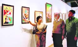 Painter Meera Ahuja shares a point with a visitor to her exhibition at PAU in Ludhiana on Monday.