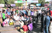 Sanitary workers protest at the Bharat Nagar chowk in Ludhiana on Monday. 
