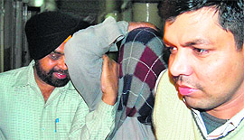 The accused (centre) in CBI custody on Tuesday. 