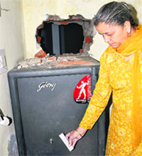A bank employee shows the place from where burglars tried to enter a bank in Dhanas, Chandigarh, on Tuesday. Tribune photo: Manoj Mahajan