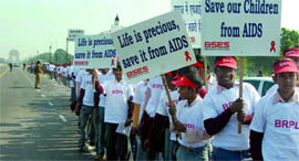 Schoolchildren take part in an AIDS awareness rally in New Delhi on Tuesday.