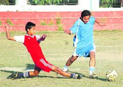 Players vie for the ball at the Sub-Junior Mir Iqbal Hussain Inter School Coca Cola Football Championship in Dehradun on Tuesday. 
