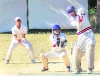 A batsman attempts a shot during a match of the Beehive Challenger Trophy T20 Cricket Tournament at Matawala Bagh in Dehradun on Tuesday. 