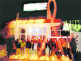 A Red Ribbon light show held on the eve of World AIDS Day at the Tanda Community Care Centre on Tuesday.