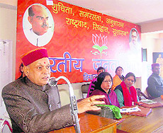 Chief Minister PK Dhumal addresses a meeting of the Mahila Morcha at the BJP office in Shimla on Tuesday.