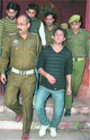 Activists of the Jammu Joint Students Federation being taken away by the police at GGM Science College in Jammu