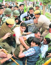 Bharatiya Janata Yuva Morcha workers on Tuesday attacked the car of Hurriyat Conference chairman Mirwaiz Umar Farooq at the Foreign Correspondents Club in New Delhi. This is the third attack on the Mirwaiz in the last five days. Scores of BJYM workers had assembled outside the club waiting for the Mirwaiz. They raised slogans as soon as the Mirwaiz arrived. Demonstrators then hurled eggs and stones at his SUV.