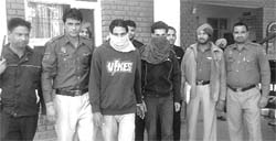 The two members of a gang of vehicle thieves in police custody at Zirakpur on Wednesday. 