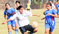 Players in action during a match between DAV Club and Carmel Convent School at Football Stadium, Sector 17, Chandigarh. 
