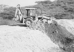 An earth mover carries out work at the proposed site of the new dumping ground in the forest area of Sector 30, Panchkula.