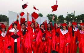 Students of Guru Gobind Singh Indraprastha University celebrate after receiving degrees during the seventh convocation of the university in New Delhi