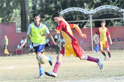 A match in the Sub-Junior Mir Iqbal Hussain Inter-School Coca Cola Football Championship in progress at Ambedkar Stadium, Dehradun, on Wednesday.