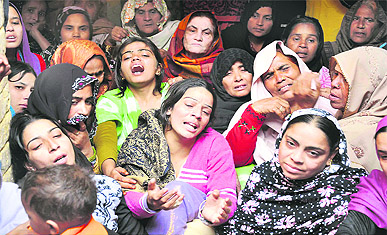 Inconsolable family members of accident victims at Jwalapur
