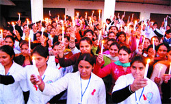 Girls take out a candlelight march on World AIDS Day in Amritsar
