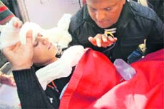 One of the injured in the minibus mishap being taken to the GMCH, Jammu, on Wednesday. 