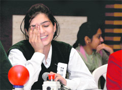 A participant of cyber quiz reacts after giving a wrong answer at Sacred Heart Convent School in Ludhiana