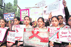 Schoolchildren take part in an awareness campaign on AIDS in Amritsar 