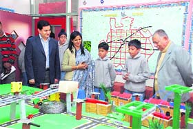 Pradeep Mehra, Adviser to the UT Administrator, takes in look at a model during an exhibition at Strawberry Fields World School, Sector 26, Chandigarh